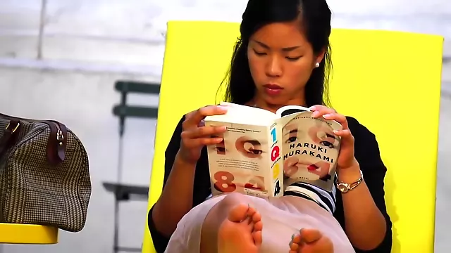 Beautiful Asian Girl Reveals Incredible Feet As She Reads Book In Public