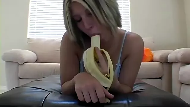 Cock teasing teen peels banana